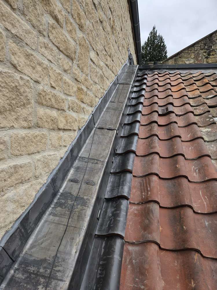 close-up of Code 5 lead flashing detail by skilled roofers in the Bath area
